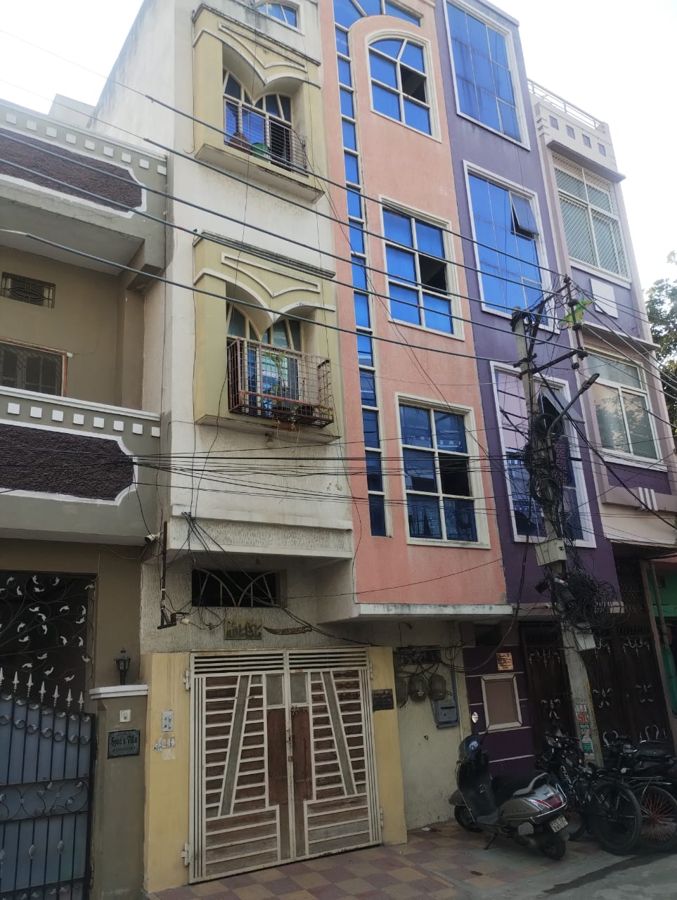 Completed G+3 independent house with arched balconies on a compact 70 square yard plot